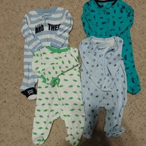 Set of 4 Carter' newborn gently used zip up onesie